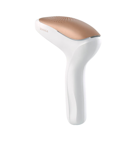White and gold hair removal device on a white background